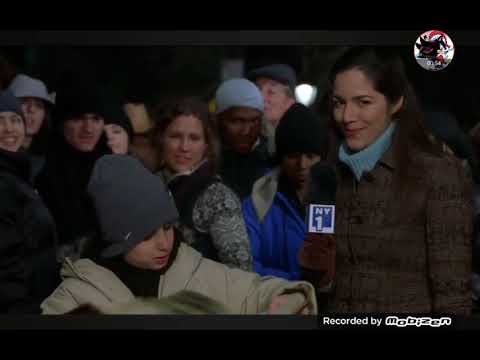 Elf (2003)- Micheal shows the crowd that Santa is real via Santa's book scene
